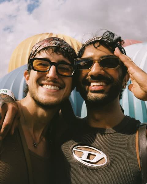two boys in sunglasses laughing, close up